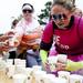 A volunteer collects cups of water to distribute to participants during the Ypsilanti Color Run on Saturday, May 11. Daniel Brenner I AnnArbor.com